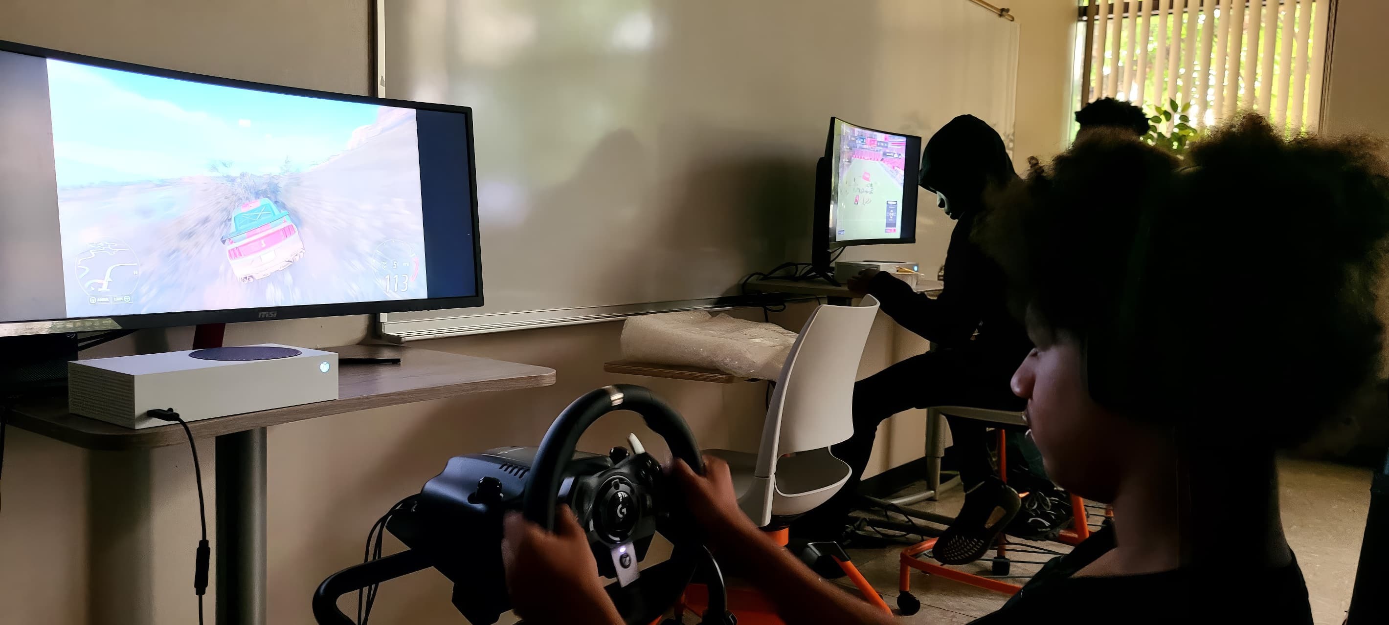 Chicago community esports bracket finals—players on stage with crowd